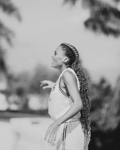 Basketball player holding the ball and preparing to shoot.